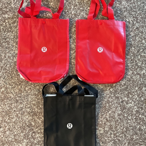 lululemon athletica Handbags - Lululemon Shopping Bags 2 Red, 1 black. Snap top 12”x9”x4”